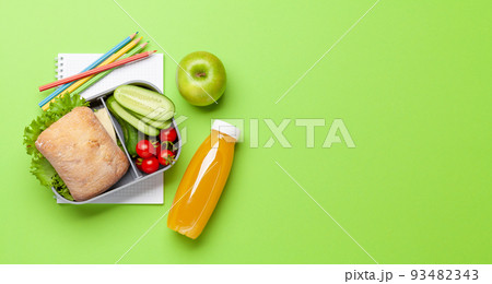 Lunch box with sandwich, vegetables and juice 93482343