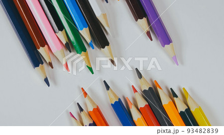 Many colored pencils are arranged around the edges of the image Many colored pencils are arranged around the edges of the image 93482839