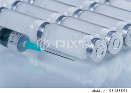 Medicine, Injection, vaccine and disposable syringe, drug concept. Sterile vial medical syringe needle. Glass medical ampoule vial for injection. Medicine, Injection, vaccine and disposable syringe, drug concept. Sterile vial medical syringe needle. Glass medical ampoule vial for injection. 93483341