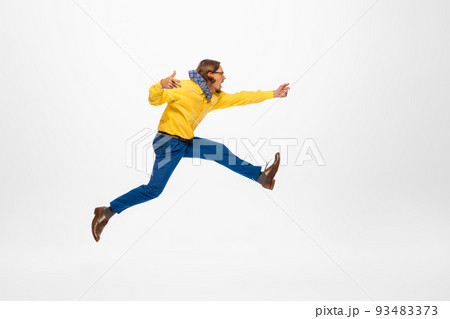 Portrait of stylish man, office worker running with new creative ideas isolated on white background. Creating projects Portrait of stylish man, office worker running with new creative ideas isolated on white background. Creating projects 93483373