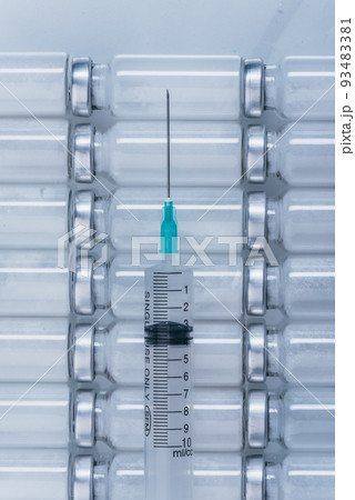 Medicine, Injection, vaccine and disposable syringe, drug concept. Sterile vial medical syringe needle. Glass medical ampoule vial for injection. Medicine, Injection, vaccine and disposable syringe, drug concept. Sterile vial medical syringe needle. Glass medical ampoule vial for injection. 93483381