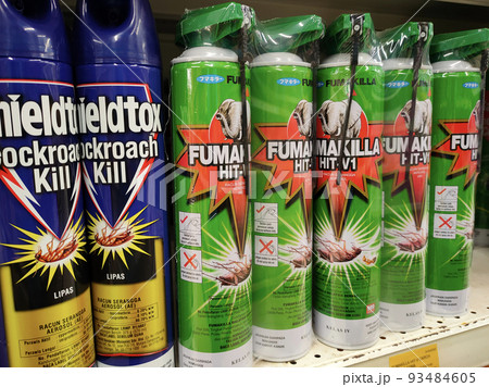 SEREMBAN, MALAYSIA -JUNE 6, 2022: Various brands of aerosol-type insecticides in commercial cans. Displayed for sale. Labeled with a price tag. SEREMBAN, MALAYSIA -JUNE 6, 2022: Various brands of aerosol-type insecticides in commercial cans. Displayed for sale. Labeled with a price tag. 93484605