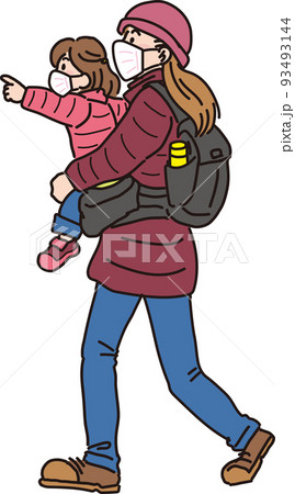 マスクして歩く_冬服の親子_前を指差す女の子を抱っこして歩くママ 93493144