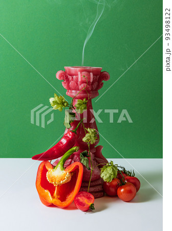 Set of healthy fresh vegetables. Red peppers, chili, tomatoes isolated over green background Set of healthy fresh vegetables. Red peppers, chili, tomatoes isolated over green background 93498122