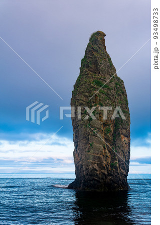 seascape of Kunashir, ocean shore with a huge vertical rock in the water seascape of Kunashir, ocean shore with a huge vertical rock in the water 93498733