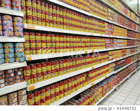 SELANGOR, MALAYSIA -JULY 6, 2022: Selective focused on sardine fish can. The fish has been processed, cook and packed in the can. Displayed on the rack for sale and tag with the price tag 93499732