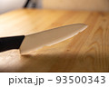old broken ceramic knife on wooden table 93500343