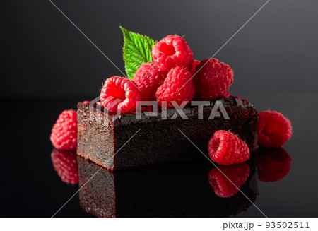 Chocolate cake with fresh raspberries. Chocolate cake with fresh raspberries. 93502511