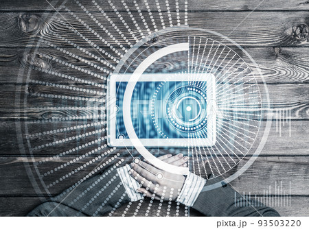Business workplace with tablet device on wooden surface and media interface Business workplace with tablet device on wooden surface and media interface 93503220