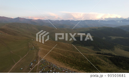 Red rays of the sun at sunset among the mountains Red rays of the sun at sunset among the mountains 93503681