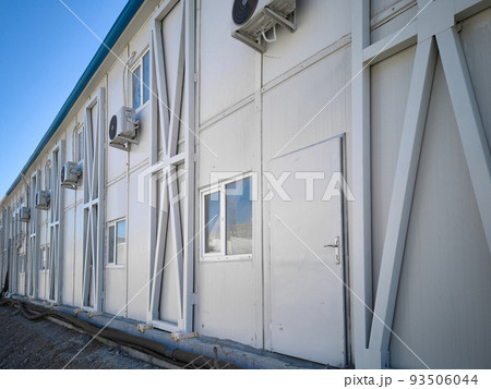 Prefabricated office container building at construction site 93506044
