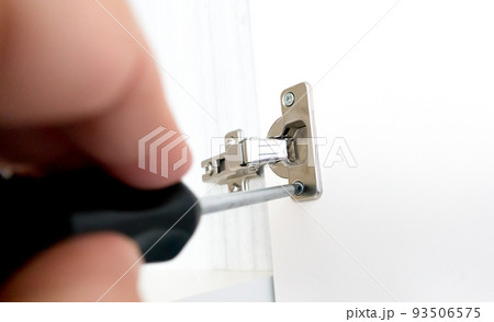 Repairman install cabinet hinge Repairman install cabinet hinge 93506575
