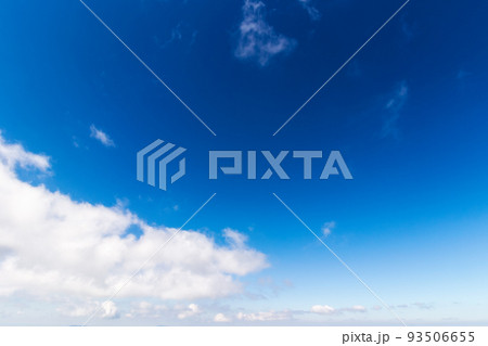 blue sky background. white fluffy clouds above horizon. sunny summer weather at high noon 93506655