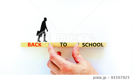 Back to school and support symbol. Concept words Back to school on wooden blocks. Businessman hand. Beautiful white table white background. Business, educational Back to school concept. Copy space. Back to school and support symbol. Concept words Back to school on wooden blocks. Businessman hand. Beautiful white table white background. Business, educational Back to school concept. Copy space. 93507925