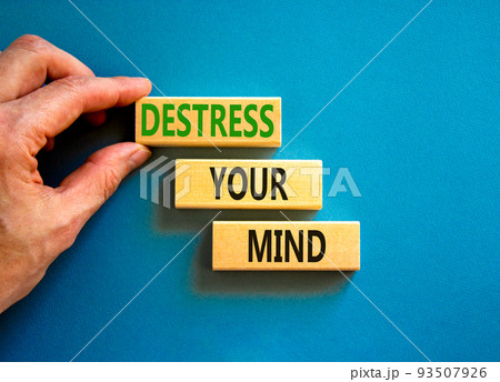 Destress your mind symbol. Concept words Destress your mind on wooden blocks. Doctor hand. Beautiful blue table blue background. Psychological business and destress your mind concept. Copy space. Destress your mind symbol. Concept words Destress your mind on wooden blocks. Doctor hand. Beautiful blue table blue background. Psychological business and destress your mind concept. Copy space. 93507926