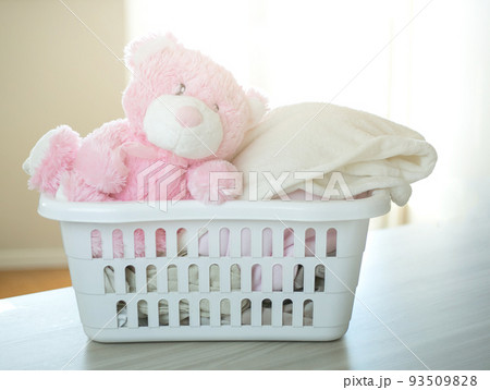 Plastic basket with clean clothes. 93509828