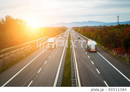 Sunrise on the highway. Transportation and traffic concept. 93511384