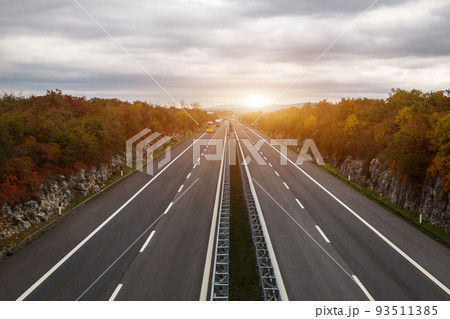 Sunrise on the highway. Transportation and traffic concept. Sunrise on the highway. Transportation and traffic concept. 93511385