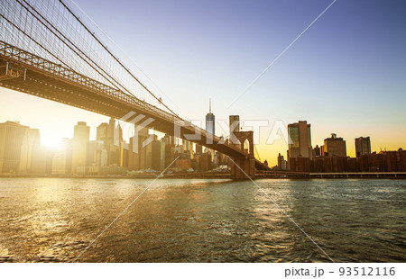 View of Brooklyn Bridge and Manhattan skyline WTC Freedom Tower from Dumbo at sunset, Brooklyn. Brooklyn Bridge is one of the oldest suspension bridges in the USA View of Brooklyn Bridge and Manhattan skyline WTC Freedom Tower from Dumbo at sunset, Brooklyn. Brooklyn Bridge is one of the oldest suspension bridges in the USA 93512116