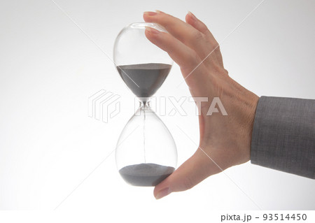 Hourglass on a light background. Time is money. Business solutions in time. 93514450