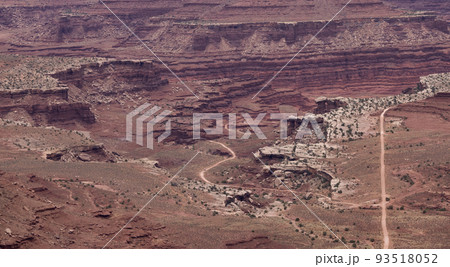 Dirt route in Desert Canyon with Scenic American Landscape and Red Rock Mountains. 93518052