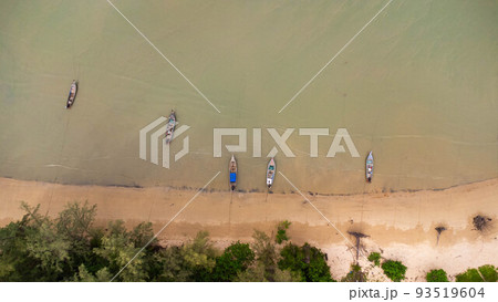 Many fishing boats near the seashore in tropical islands. Pier of the villagers on the southern island of Thailand. top view from drones. Many fishing boats near the seashore in tropical islands. Pier of the villagers on the southern island of Thailand. top view from drones. 93519604