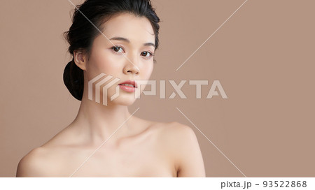 Beautiful young asian woman with clean fresh skin on beige background, Face care, Facial treatment, Cosmetology, beauty and spa, Asian women portrait. 93522868
