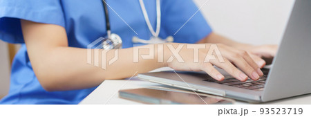 Pet care concept, Female veterinary searching data on laptop to writing prescription for pet Pet care concept, Female veterinary searching data on laptop to writing prescription for pet 93523719