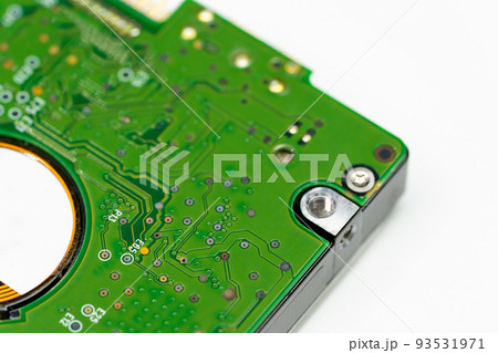 Closed up shot of an internal Hard disk electronic board in green color. Closed up shot of an internal Hard disk electronic board in green color. 93531971