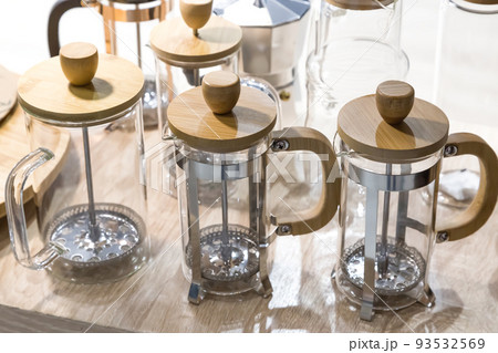 French press glass empty, coffee makers for brewing a hot drink. New crockery and kitchen utensils for the kitchen 93532569