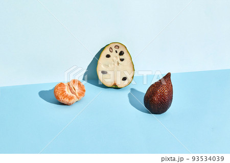 Half of sugar-apple, fruit of Annona squamosa cherimoya and figs and mandarin Half of sugar-apple, fruit of Annona squamosa cherimoya and figs and mandarin 93534039