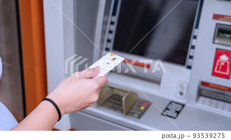 Atm money machine cash. Money bank credit card holding hand. Withdraw money cash from atm. Bank credit card, us dollar. 93539275
