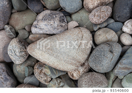 Large stones of different shapes on the riverbank close-up. 93540600