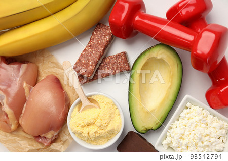 Concept of sports nutrition on white background, top view Concept of sports nutrition on white background, top view 93542794