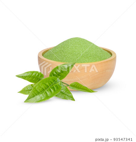 Green tea powder in a wooden cup  with leaves isolated on white background 93547341