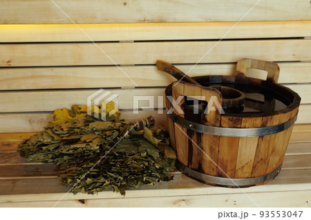 Sauna accessories, bucket, ladle and broom for sauna on wooden planks Sauna accessories, bucket, ladle and broom for sauna on wooden planks 93553047