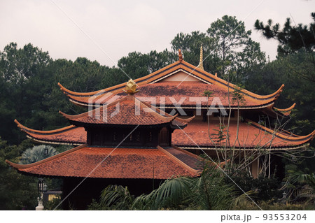 Roof of Truc Lam Phung Hoang Zen Monastery in Da lat, Vietnam hidden among the trees Roof of Truc Lam Phung Hoang Zen Monastery in Da lat, Vietnam hidden among the trees 93553204