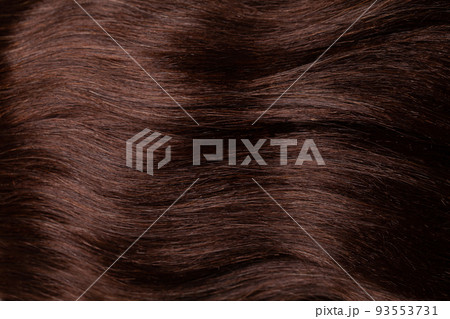 Closeup view of colored brown hair, haircare background Closeup view of colored brown hair, haircare background 93553731
