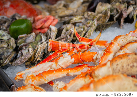 Crab claws on counter at summer local fish market - close up Crab claws on counter at summer local fish market - close up 93555097