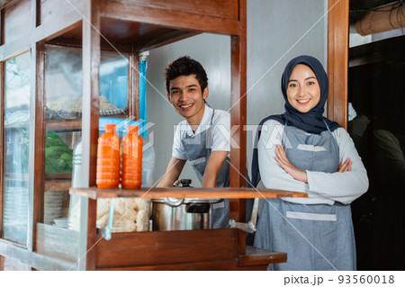 veiled woman wearing apron with hands crossed and young man veiled woman wearing apron with hands crossed and young man 93560018