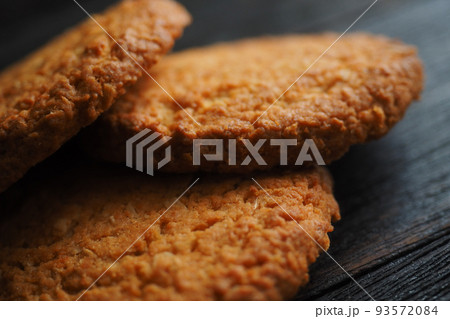 Delicious oatmeal cookies are on table. Healthy dessert for tea and breakfast close-up. Cereal food. 93572084