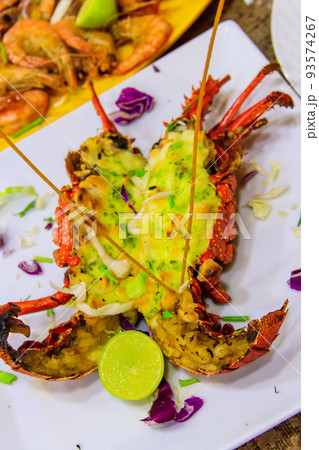 Delicious grilled lobster in a white plate in restaurant 93574267