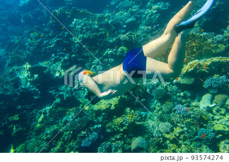 Man snorkeling underwater by coral reef in the Red sea, Egypt 93574274