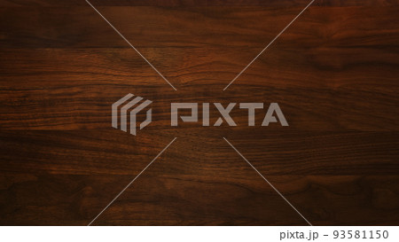 ウォールナットの焦茶色の木目の板材の表面の背景画像 93581150