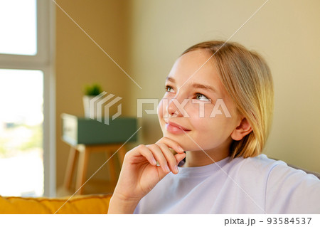 cute little girl in living room looking inspired and happy cute little girl in living room looking inspired and happy 93584537