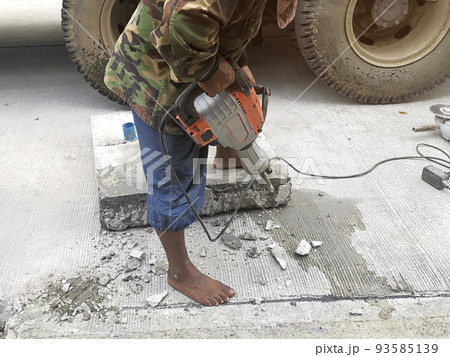 Real construction worker working on a cement pipe cap renovation. Real construction worker working on a cement pipe cap renovation. 93585139