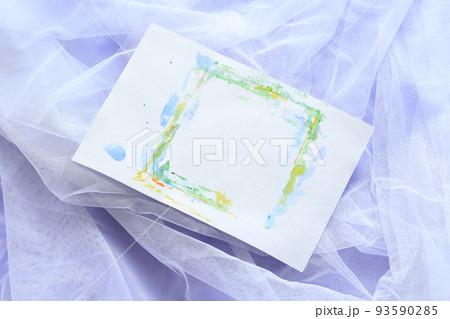 empty paper sheet with aquarelle on white tulle with purple background empty paper sheet with aquarelle on white tulle with purple background 93590285
