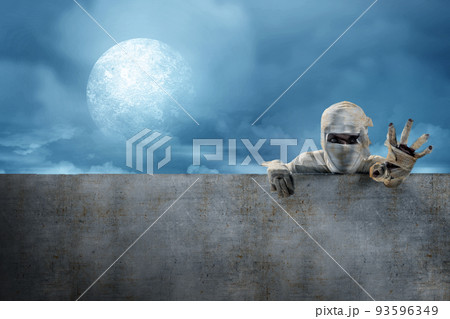 Mummy comes from behind the wall 93596349