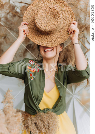 playful woman straw hat dry plants autumn 93601859
