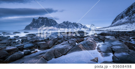 Rocky beach in winter at night. Sea coast with stones Rocky beach in winter at night. Sea coast with stones 93608498